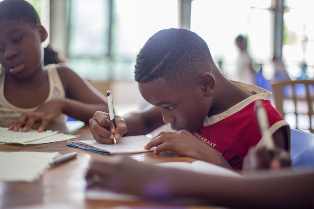 Boy writing on paper Boy writing on paper
